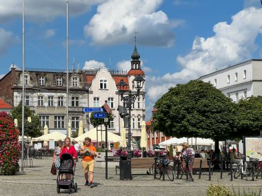 Tarnowskie Gory, Poland, July 18, 2024: The town square with a visible Evangelical-Augsburg Savior Church in Tarnowskie Gory and old tenement houses. clipart