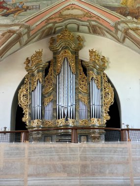 Saint Anne, Poland, July 23, 2024: Church of Saint Anne and Dominican Sisters' monastery in Saint Anne, Poland. Interior of the church with a visible organ, ceiling, pulpit and exit door. clipart