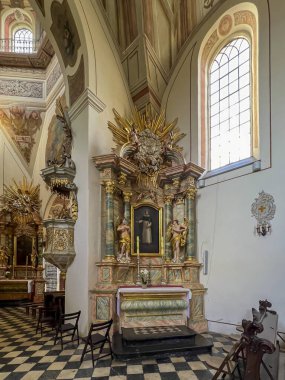 Saint Anna, Poland, July 23, 2024: Church of Saint Anne and Dominican Sisters' monastery in Saint Anna, Poland. Interior, one of the side altars. clipart