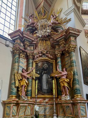 Saint Anna, Poland, July 23, 2024: Church of Saint Anne and Dominican Sisters' monastery in Saint Anna, Poland. Interior, one of the side altars. clipart