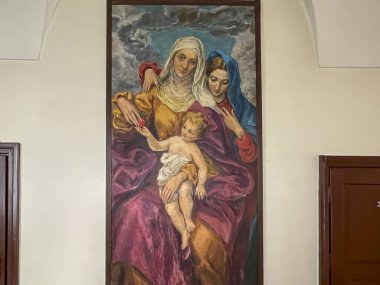 Saint Anna, Poland, July 23, 2024: Church of Saint Anne and Dominican Sisters' monastery in Saint Anna, Poland. Interior, a painting on the wall depicting Mary with her mother and son (Anna and Jesus). clipart