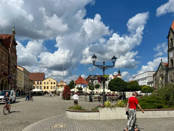 stock image Tarnowskie Gory, Poland, July 18, 2024: The town square with a visible Evangelical-Augsburg Savior Church in Tarnowskie Gory and old tenement houses.