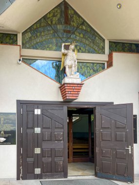 Siedlec, Poland, July 23, 2024: Sanctuary of Saint Padre Pio - a sanctuary located on Przeprosna Gorka in Siedlec near Czestochowa in Poland. Polish San Giovanni Rotondo. Entrance to the upper church. clipart