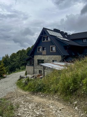 Mountain shelter under the summit of Jaworzyna Krynicka in the Beskid Sadecki. clipart