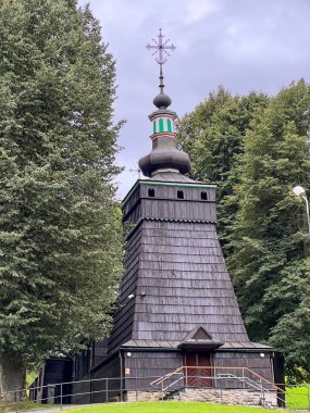 A historic Greek Catholic wooden church (Lemko) in the village of Milik near Muszyna. Currently the Roman Catholic Church of Cosmas and Damian. clipart