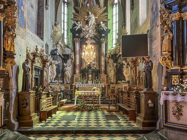 Stary Sacz, Poland, August 4, 2024: Interior of the Church of the Holy Trinity and Saint Clara in Stary Sacz - presbytery and main altar.