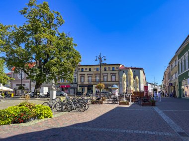 Lubliniec, Poland, August 13, 2024: The Market Square in Lubliniec with the figure of St. Teresa Benedicta of the Cross as a child, because she used to visit her family there as a child. clipart