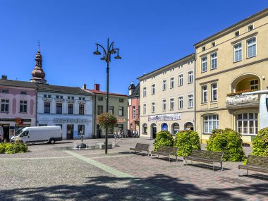 Lubliniec, Poland, August 13, 2024: A fountain on the market square in Lubliniec with a figure of St. Teresa Benedicta of the Cross as a child, because she used to visit her family there as a child. clipart