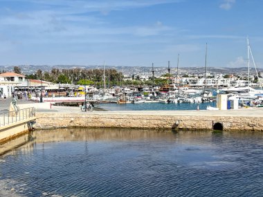 Paphos, Cyprus, October 13, 2024: The port of Paphos, Cyprus. The port quay with moored yachts, small ships and various port equipment. clipart