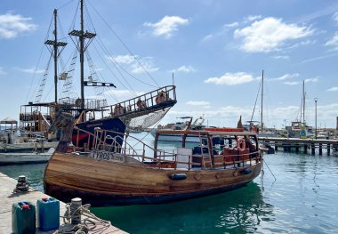 Paphos, Cyprus, October 13, 2024: The port of Paphos, Cyprus. The port quay with moored yachts, small ships and various port equipment. clipart