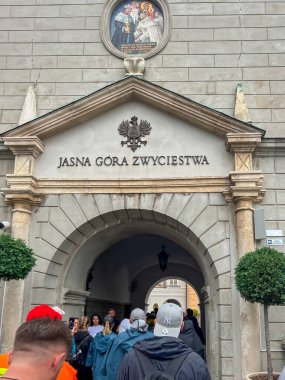 Czestochowa, Poland, August 19, 2024: Pilgrims enter the national Marian sanctuary of Jasna Gora, towards the chapel of the miraculous image. clipart