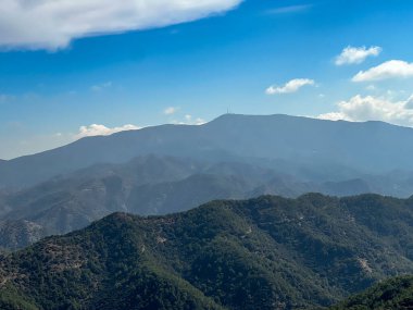 Mountain panorama seen from Throni Hill from the area of Kykkos Monastery in the Troodos Mountains in Cyprus, close to the village of Milikuri clipart