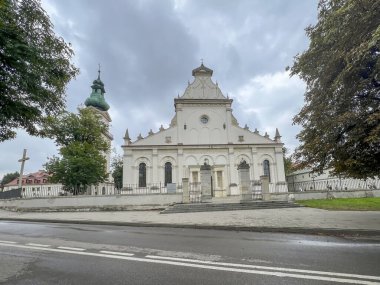 The Bell Tower and Cathedral of the Resurrection of Our Lord and St. Thomas the Apostle in Zamosc, Poland. clipart