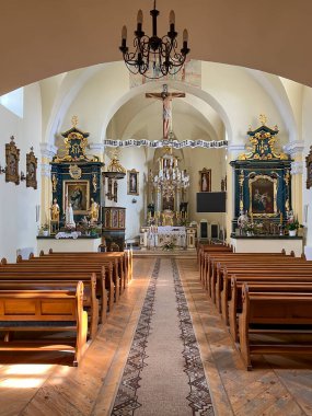 Sawin, Poland, September 11, 2024: Interior of the Church of the Transfiguration of the Lord in Sawin in eastern Poland, consecrated in 1751. Lublin Diocese, Chelm West deanery. clipart