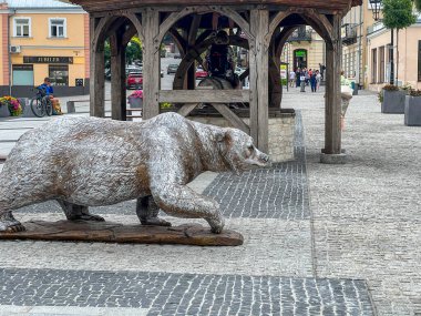 Chelm, Poland, September 10, 2024: Doctor Edward Luczkowski Square in Chelm - the former old town square with an old well and a white bear 