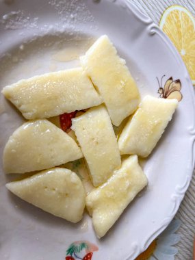 Kopytka or szagowki (Polish potato pasta similar to Italian gnocchi) prepared for a home-cooked dinner. clipart