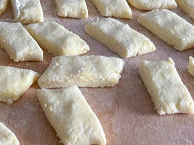 Kopytka or szagowki (Polish potato pasta similar to Italian gnocchi) prepared for a home-cooked dinner. clipart