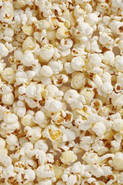 Lezzetli patlamış mısırın arka planı. Üst görünüm