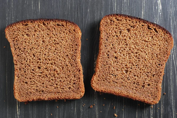 Slices Rye Bread Black Wooden Background Top View — Stock Photo, Image