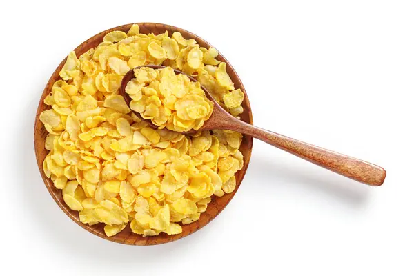 玉米片在木制板与勺子白色背景 顶部视图 传统谷物早餐 — 图库照片