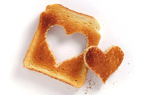 Toastbrot Mit Herzförmigem Ausschnitt Auf Weißem Hintergrund Ansicht Von Oben — Stockfoto