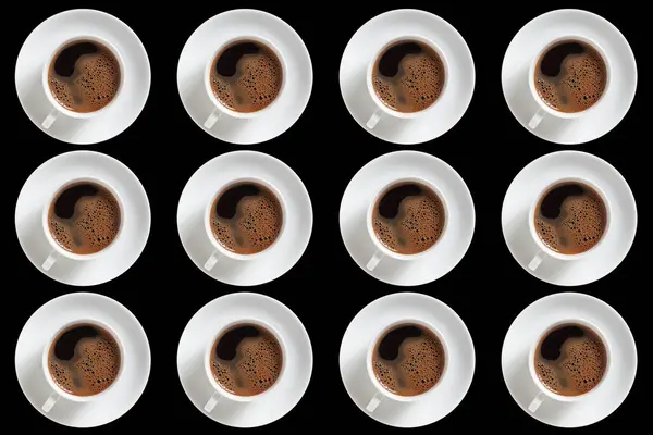 Background of several cups of coffee isolated on black, top view
