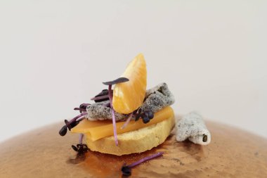 fish free smoked lax on rusk with cress and seaweed chips