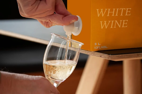 Hand Pouring White Wine Glass Bib Cardboard Bag Box Open — Stock Photo, Image