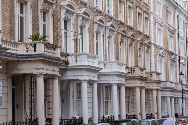 Row of typical English attached terrace houses in London, England.