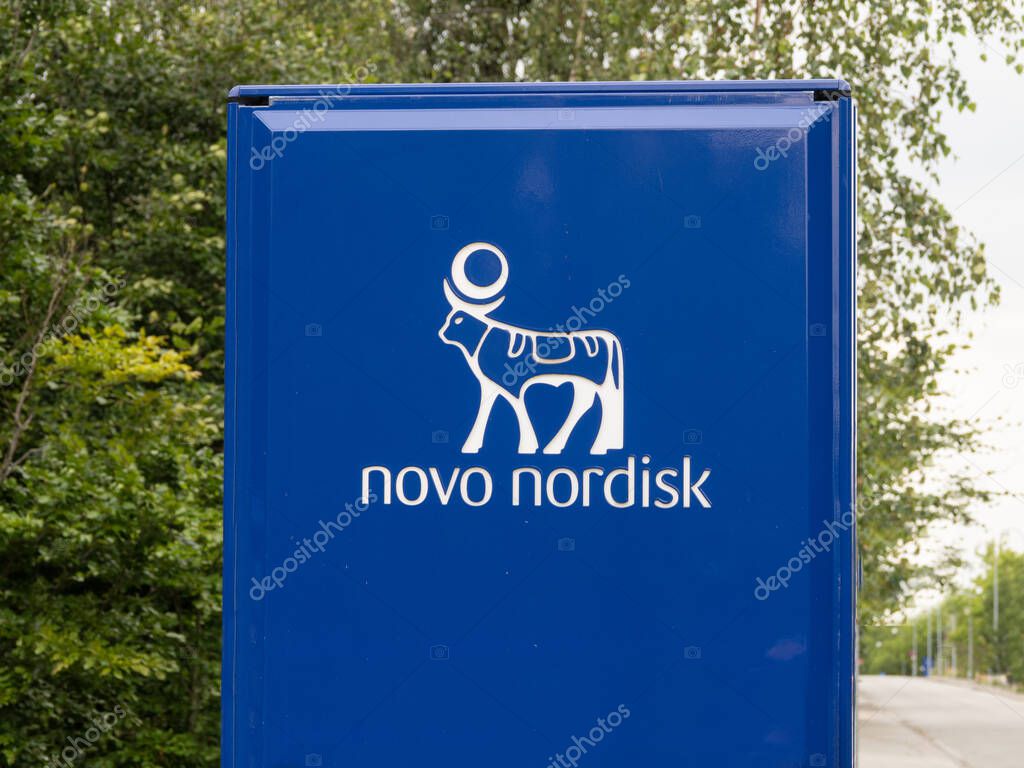 Signpost with logotype at Novo Nordisk corporate headquarters. A pharmaceutical company headquartered in Denmark. Copenhagen, Denmark - august 12, 2023.