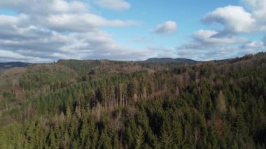 Green forests and blue sky with clouds in Bavaria