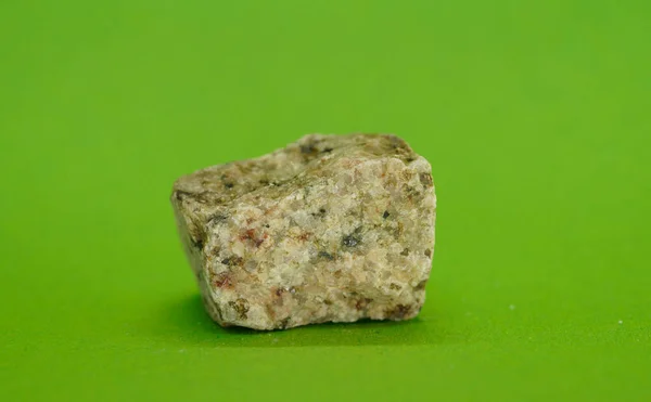 natural mineral on a green background with crystal quartz crystals is a  beautiful background and an abstract, macro