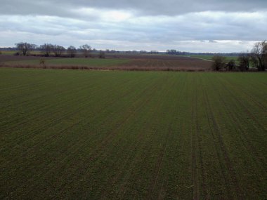 Green fields in Bavaria in the valley with aerial view in winter