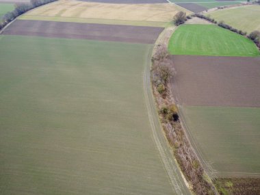 Green fields in Bavaria in the valley with aerial view in winter