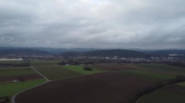 Fields and meadows with rain clouds in winter