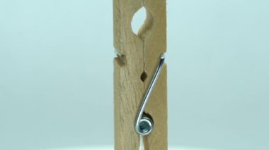 this is a wooden clothespin rotates