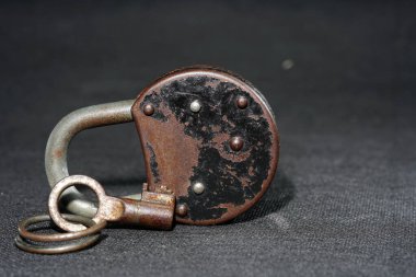 old rusty chain on dark concrete background, closeup. copy space, top view.