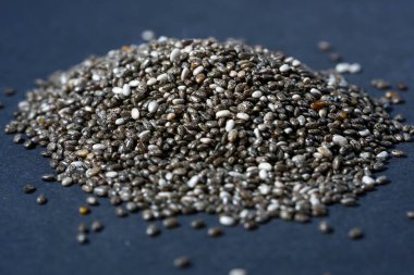black sesame seeds on a gray background
