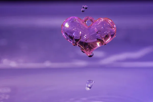 heart shape with drops of water on a white background
