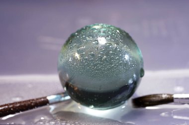 a closeup shot of a beautiful pink and silver beads on a light background