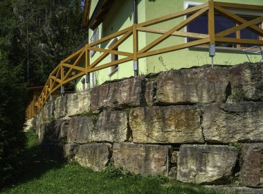 ancient stone house on a background of an old building