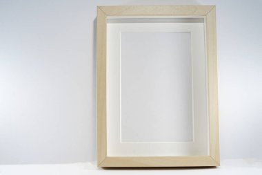white empty wooden frame on a light background. 3d rendering