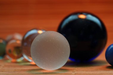 balls of black and white eggs on a wooden background