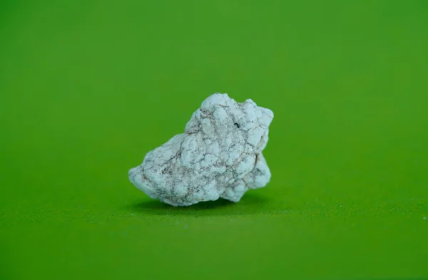 green background with crystal quartz crystals is a  beautiful background and an abstract, macro