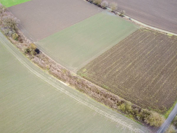 stock image Green fields in Bavaria in the valley with aerial view in winter