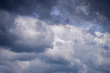 Stratus cumulus alto nimbo clouds in the blue sky are weather messengers