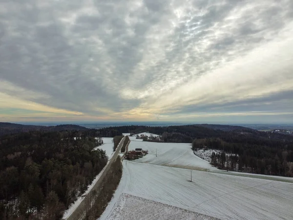 stock image snow-covered agricultural fields in bavaria on a cloudy day