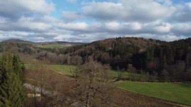 Green forests and blue sky with clouds in Bavaria