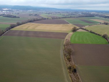 Green fields in Bavaria in the valley with aerial view in winter
