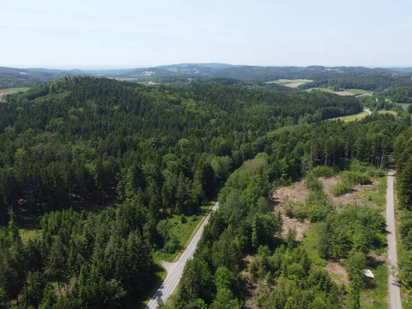 stock image Aerial view of the road in the forest. drone photography